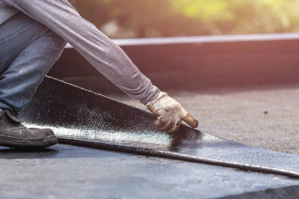 Professional Basement Waterproofing technician working in Woodsville, NH